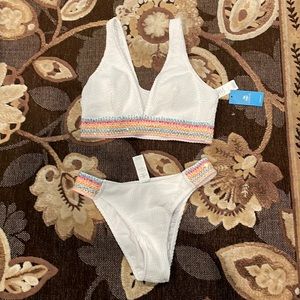 Bikini top and bottom NEW with tags. Medium white with rainbow sequin lining